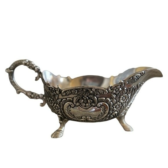 Ornate footed sauce boat or gravy boat resists tarnish